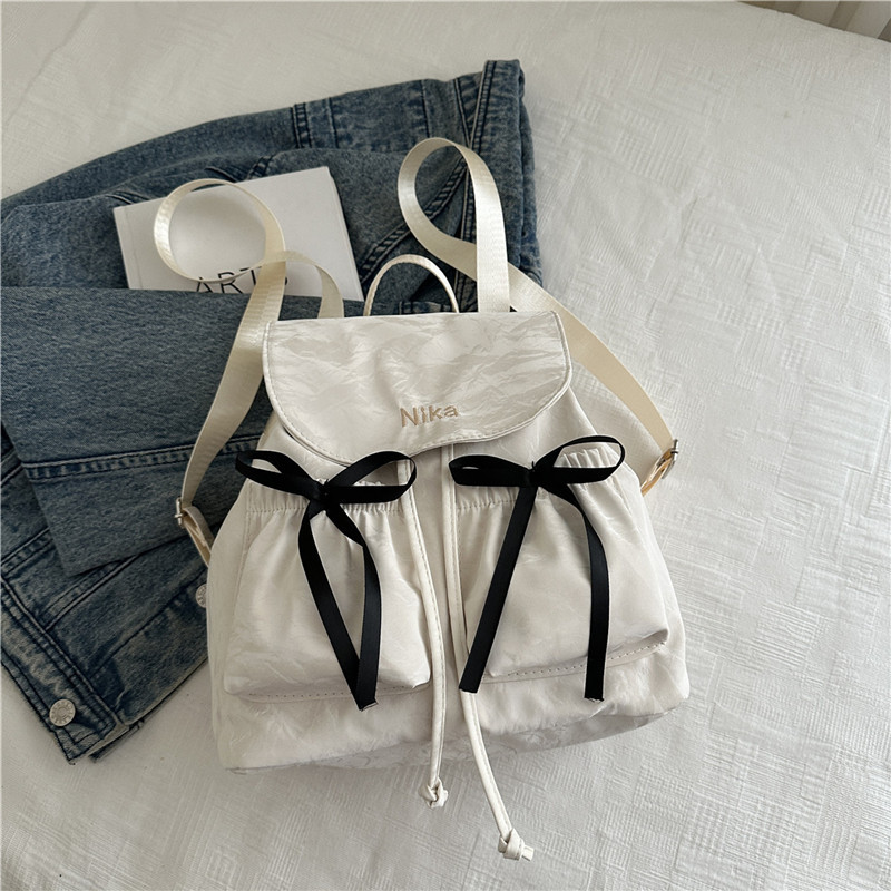 Mochila de lazo de sentido de alta gama para mujer 2025 nueva moda mochila de viaje mochila escolar casual para estudiantes coreanos