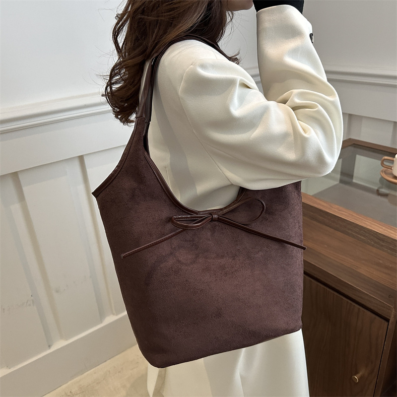 Bolsa de viaje al trabajo para mujeres estilo coreano retro de alta capacidad bolso de brazo 2025 primavera alta sensación bolso de hombro