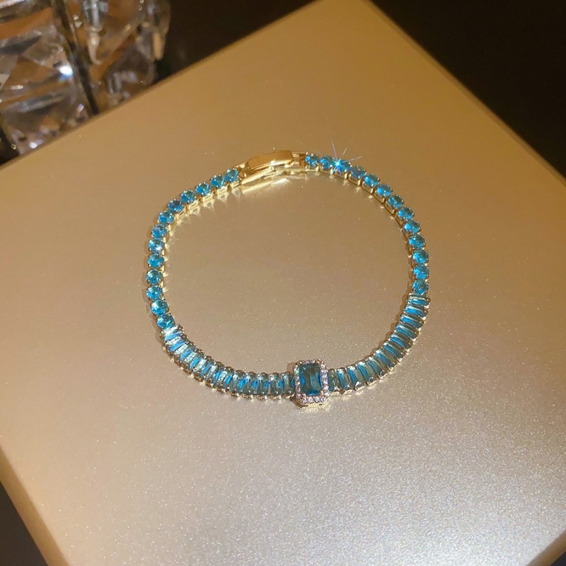 20 pulseras - doradas - azules