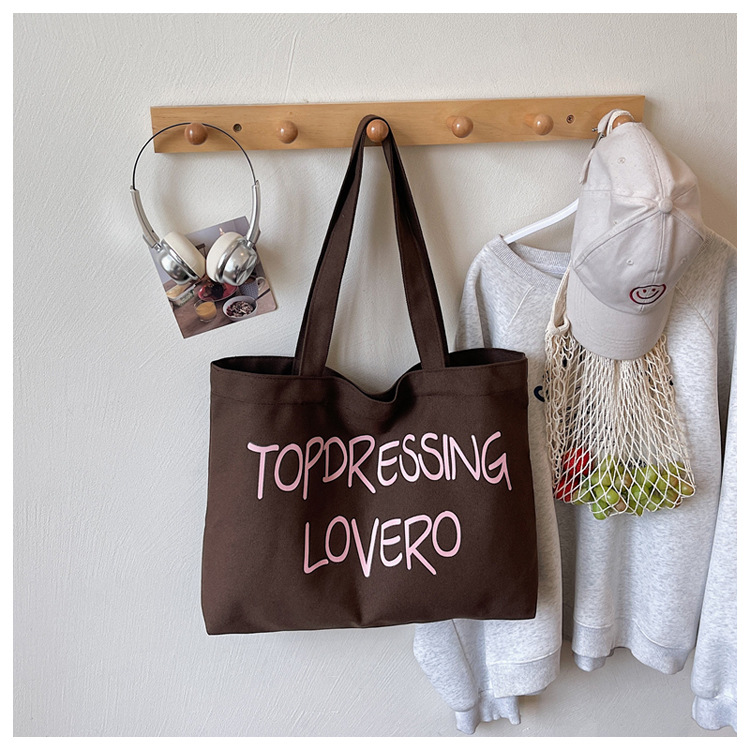 Bolsas coreanas de gran capacidad para mujeres 2026 nuevas letras de impresión de moda bolsas axilales de hombro para viajar bolsas de ocio