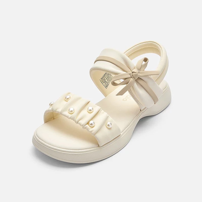 Zapatos de playa de moda de niñas versátiles 2026 verano nuevos zapatos de arco para niños Lefour zapatos de princesa huecos