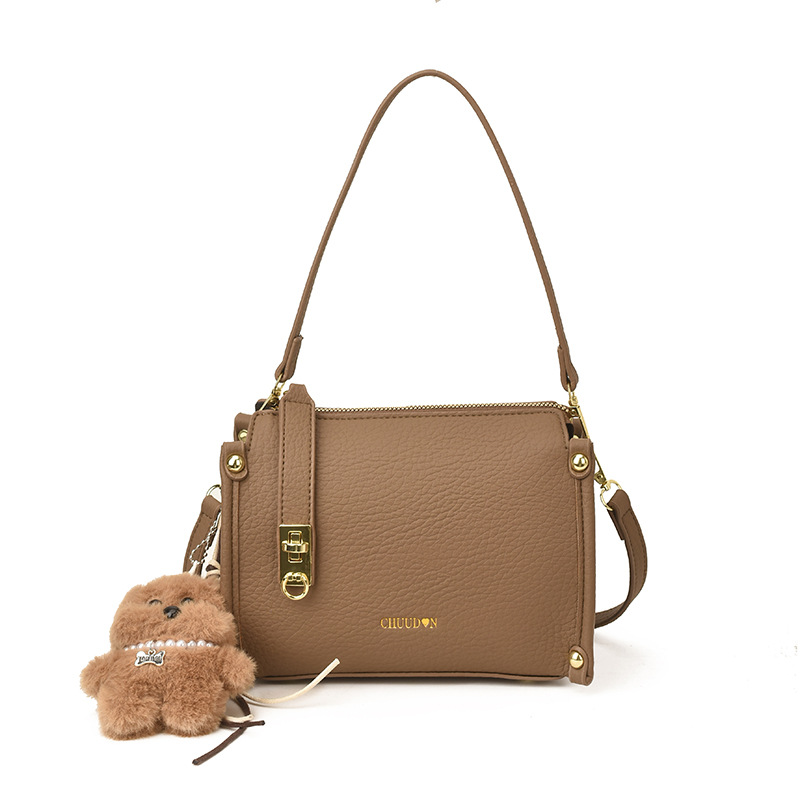 Bolsos retro retro de alta calidad para mujeres 2026 nueva textura lichi bolso pequeño estilo coreano simple mochila de hombro