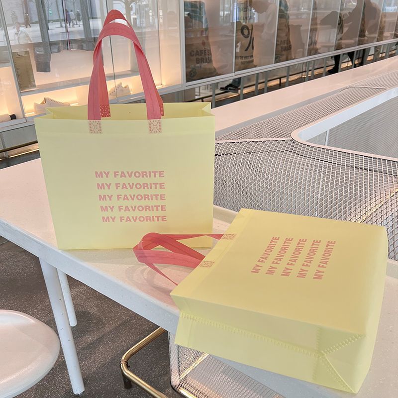 ins少女奶油风无纺布袋服装店手提袋购物环保礼品袋外卖打包钉制