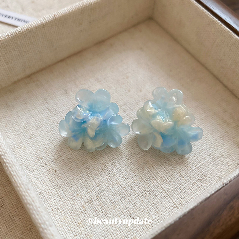 Pendientes de flores de súper hadas manchadas con agujas de plata Pendientes de todo fósforo de moda Personalidad femenina Pendientes de temperamento de lujo ligero Sensación de clase alta de nicho