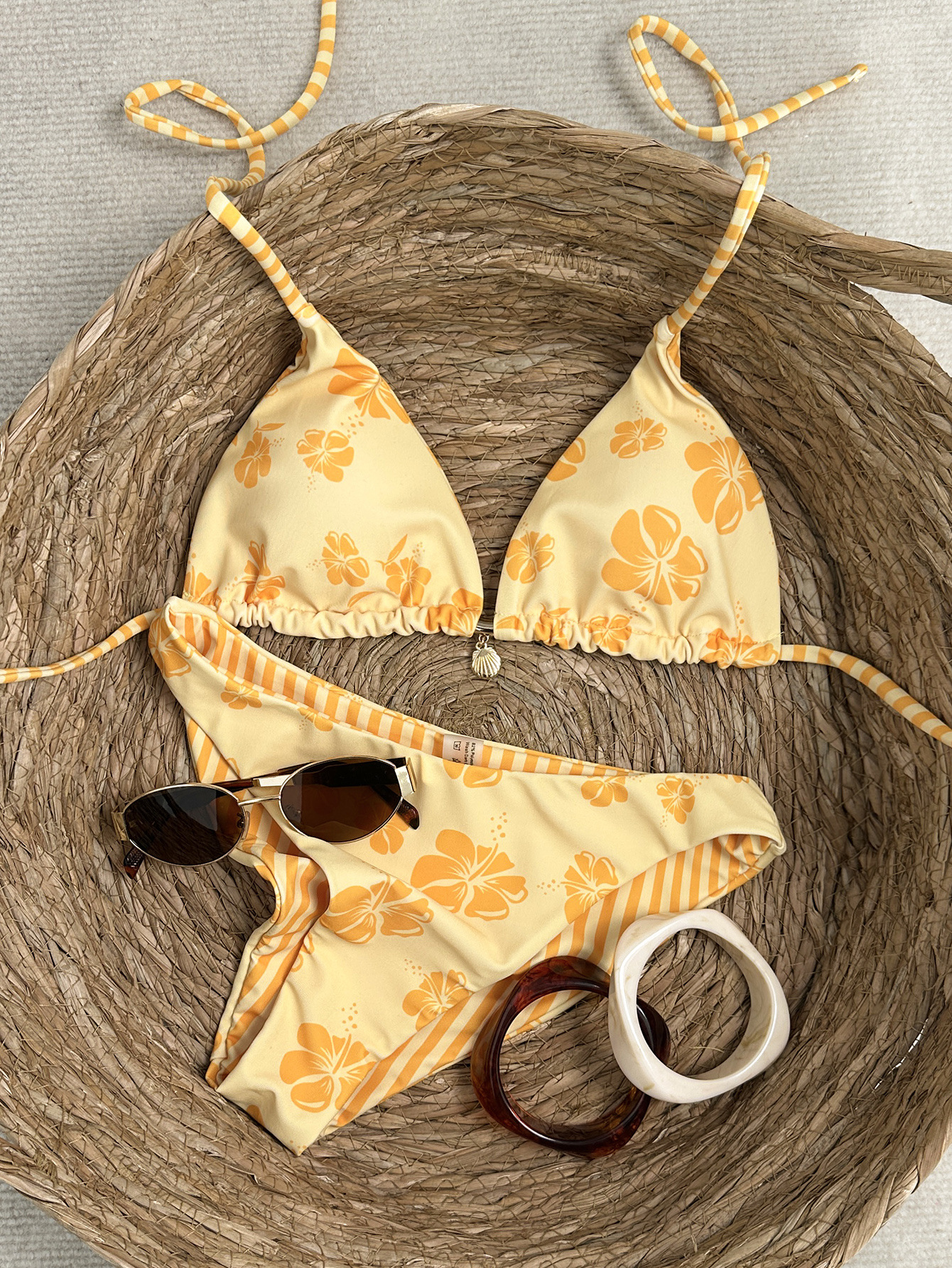 2026 New European and American Style Yellow Printed Bikini Two-Piece Swimsuit for Women with Triangle Cups, Halter Neck, and Tie-Up Design for Beach Vacation