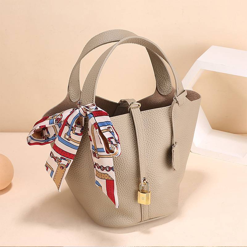 2022 New Top Layer Cowhide Litchi Pattern Designer Creative Gold Lock Buckle Vegetable Basket Women's Bag Portable Bucket Bag