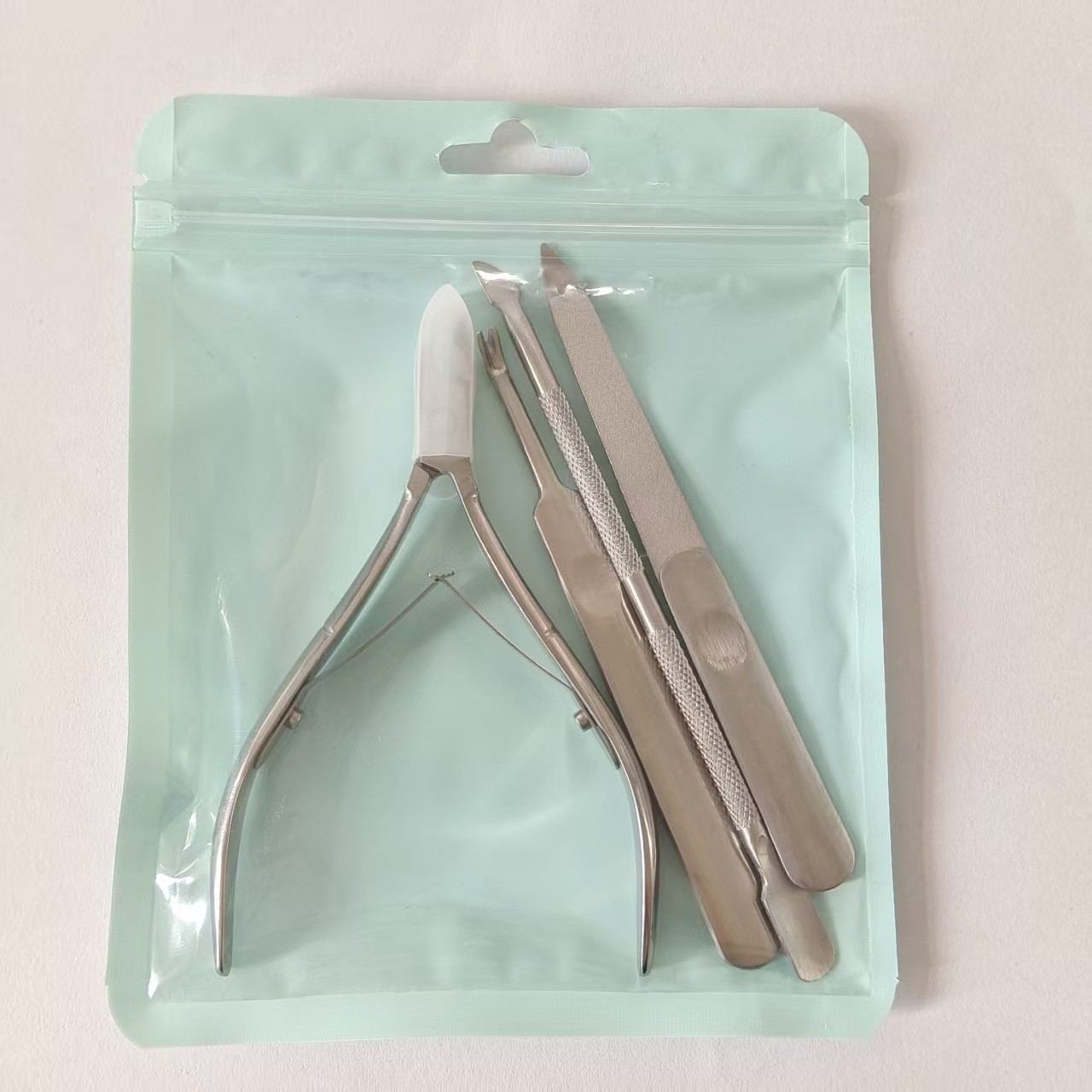 Cuticle scissors type A + sanding steel pusher + nail file + cuticle fork