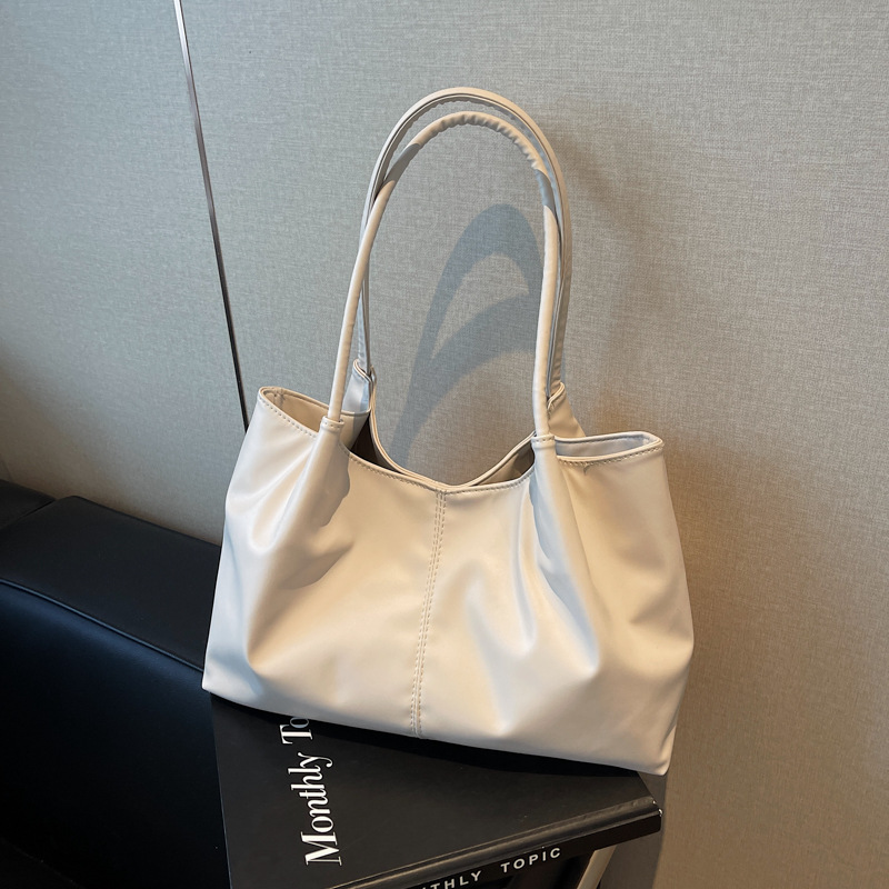 Bolsas de invierno de nicho de diseño de mujeres 2024, bolsas de hombro de gran capacidad populares de estudiantes este año