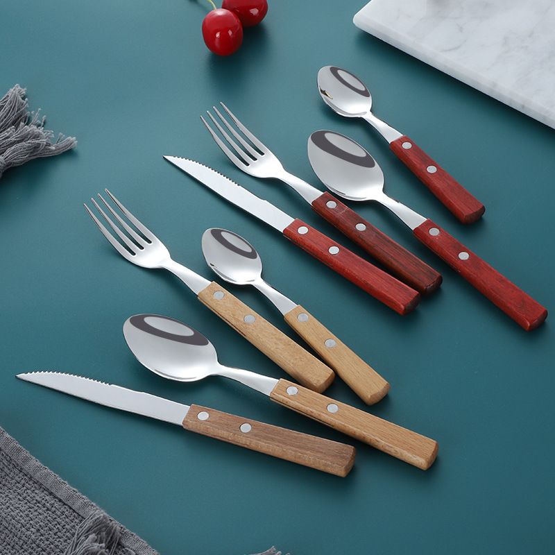 Venta al por mayor 304 cuchillo de acero inoxidable, tenedor y cuchara de cuatro piezas de estilo japonés vajilla occidental palo de rosa mango cuchillo de carne, tenedor y cuchara traje