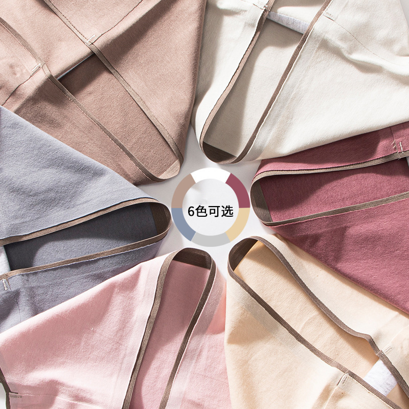 Ropa interior de algodón elástica de cintura media sin costuras logotipo offset tridimensional ropa interior de color sólido de las mujeres calzoncillos de entrepierna de algodón que absorben la humedad