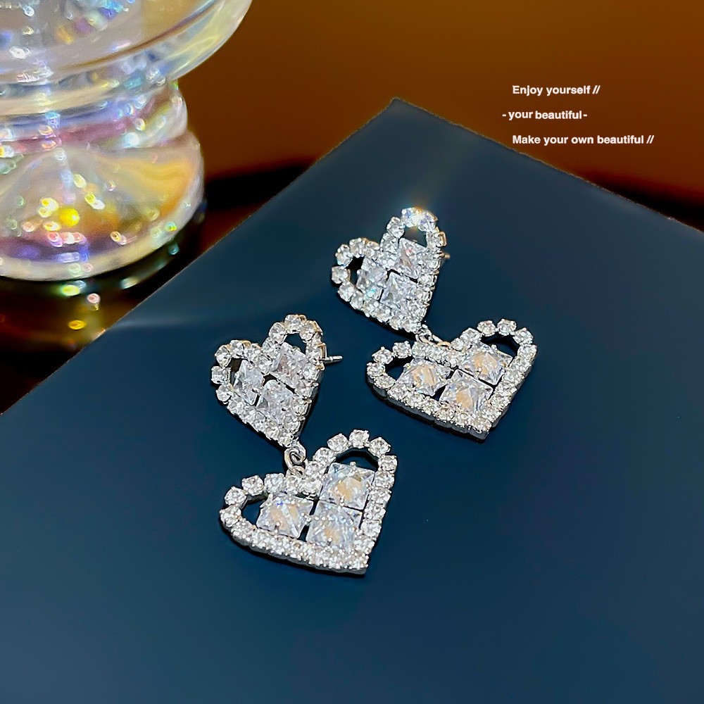 S925 aguja de plata elegante borla pendientes de alta gama simple cara de adelgazamiento pendientes de todo fósforo estilo coreano nuevos pendientes de moda al por mayor