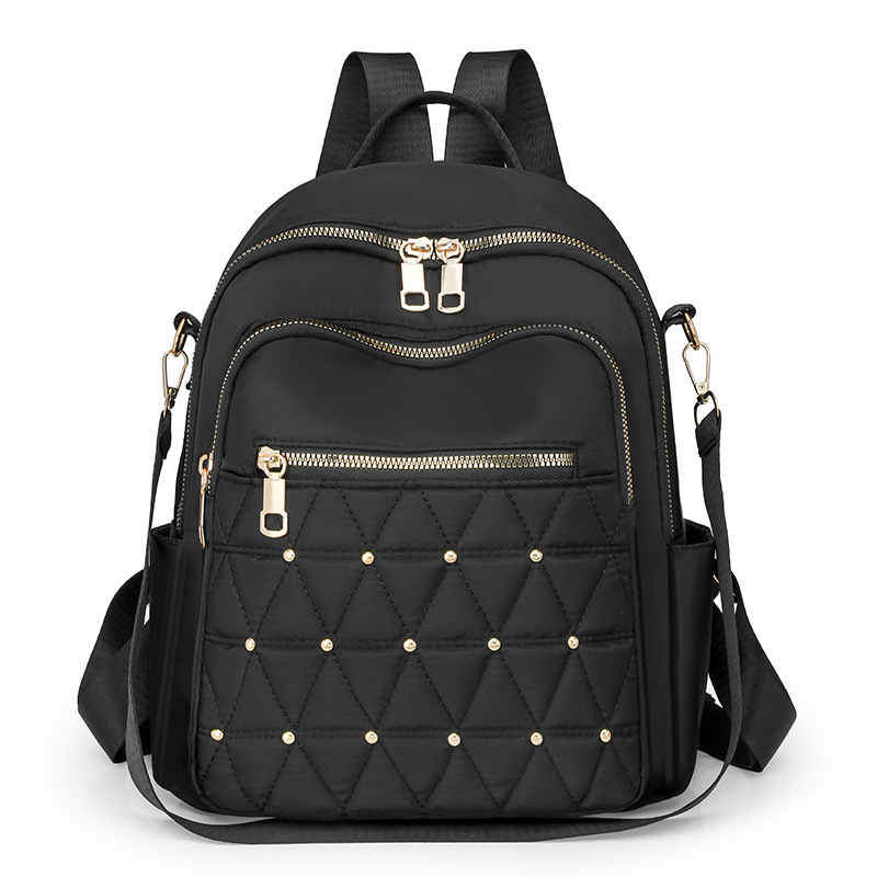 Mochila con remaches bordados de ringge para mujer 2025 nueva bolsa de viaje de moda casual todo-fósforo de gran capacidad para mujer