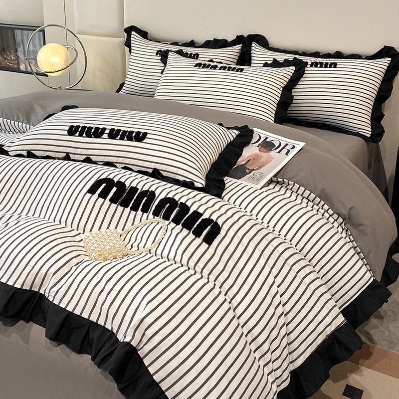 2024 nuevo estilo francés pequeño bordado de toalla de fragancia cuatro piezas funda de edredón sábana simple ropa de cama Nantong al por mayor