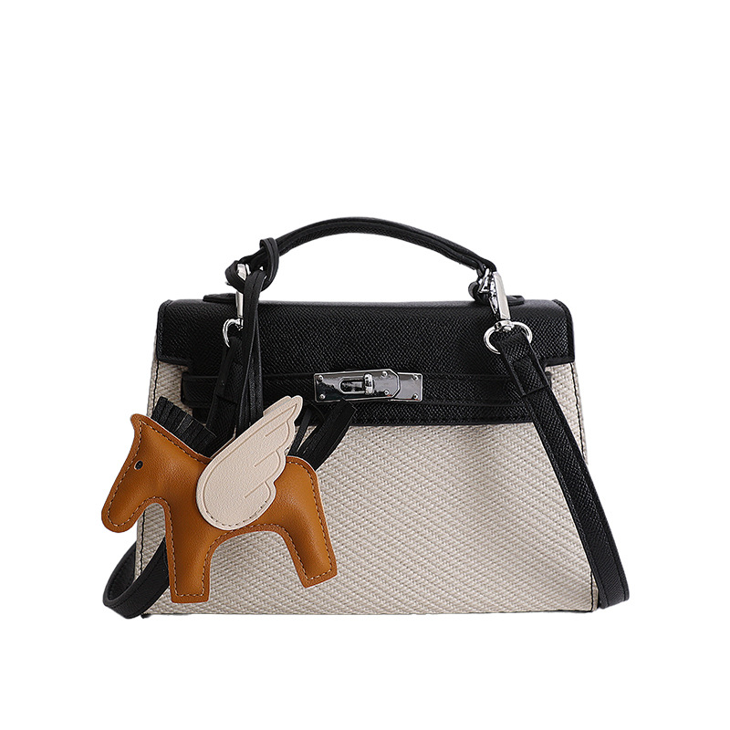 Textura de nicho bolso de diseño de mujer 2026 nuevo bolso Kylie color contraste diario simple viaje mochila de hombro