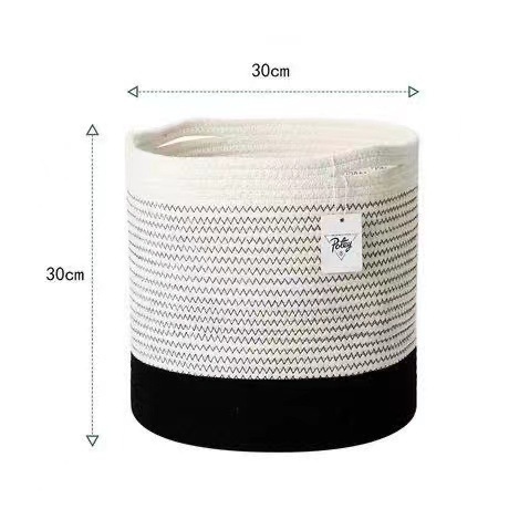 北欧の綿の縄の汚い服のかごの家庭用の円形の編み物の収納かごの大容量はおもちゃの間食をつづり合わせてかごを編みます。|undefined
