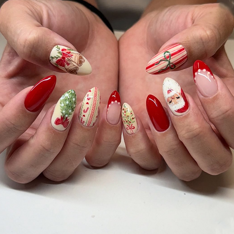 Medium almond-shaped Christmas nails with bows, wind chimes, Christmas trees, and Santa Claus designs, French-style false nails Medium almond-shaped Christmas nails with bows, wind chimes, Christmas trees, and Santa Claus designs, French-style false nails