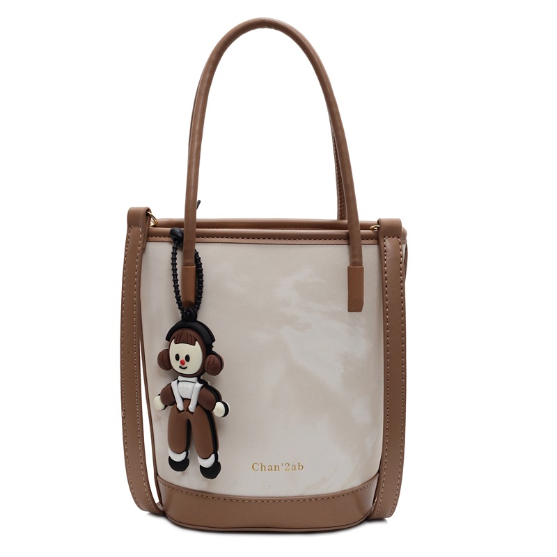 Tendencia versátil nicho de diseño de bolso de cubo de mano mujer 2025 nuevo estilo casual estilo extranjero sensación de alto hombro mochila