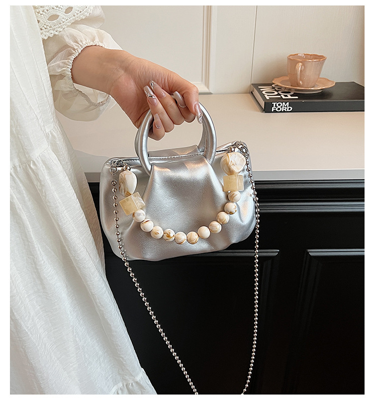 High end handbag for women in 2024, new niche design, summer handheld pleated chain strap, crossbody cloud bag_voghion.com