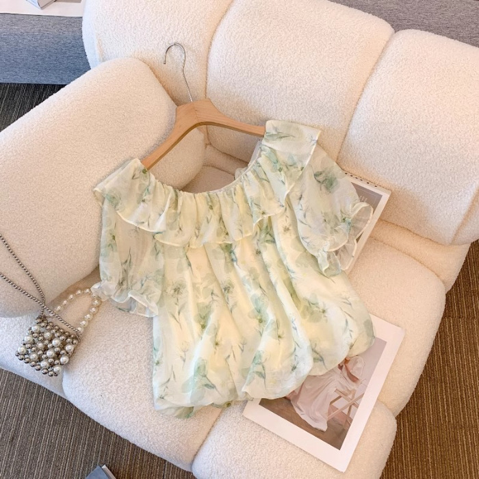 夏の太ったmmのゆったりした大きいサイズのシフォンの泡の袖のシャツの半袖の女性はやせている花を現します。|undefined