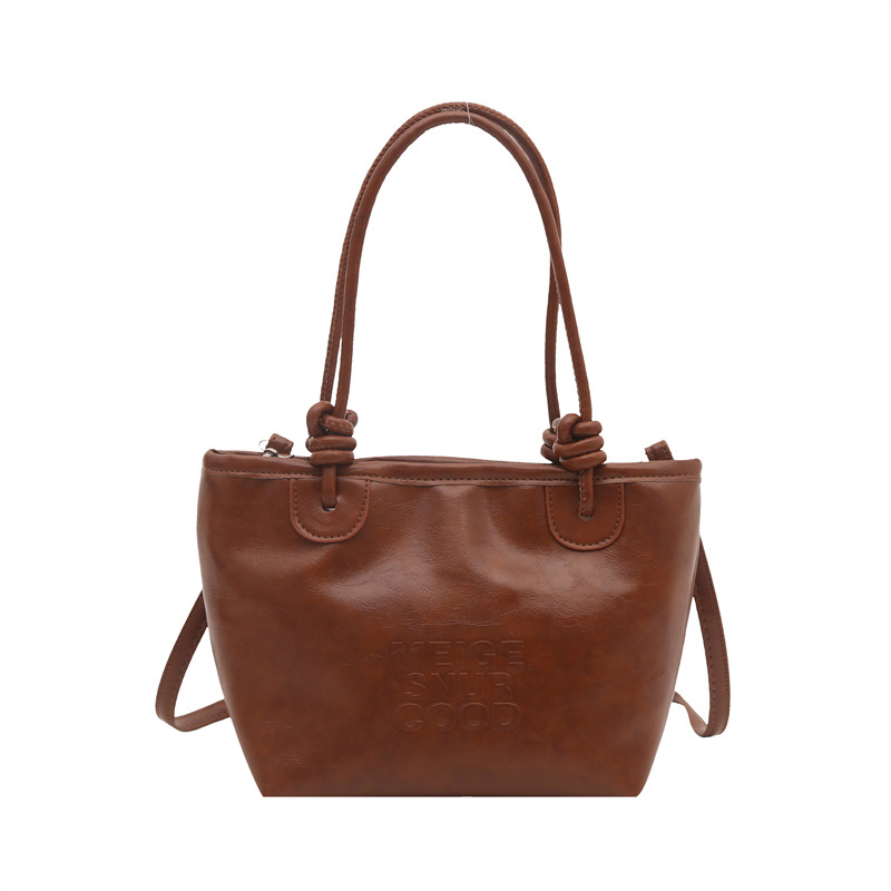 Estilo occidental retro pequeño bolso femenino 2024 nuevo otoño e invierno bolso de mensajero literario de moda bolso de cubo portátil de moda