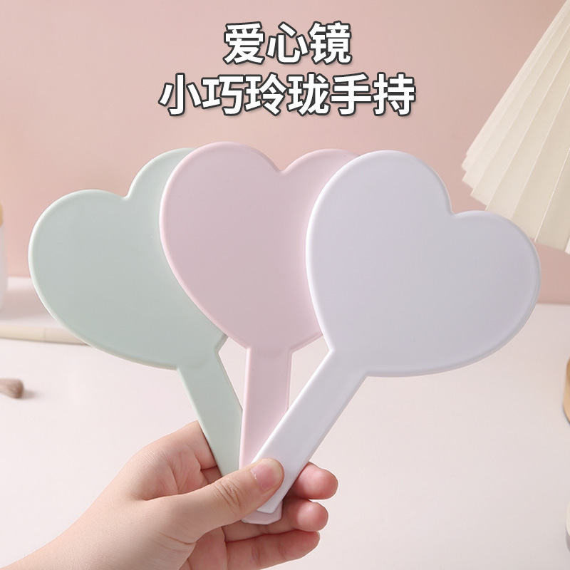 Heart-Shaped Handheld Mirror with Logo Printed on the Handle, High-Definition Makeup Mirror, Portable Touch-Up Mirror, Small Makeup Mirror Heart-Shaped Handheld Mirror with Logo Printed on the Handle, High-Definition Makeup Mirror, Portable Touch-Up Mirror, Small Makeup Mirror