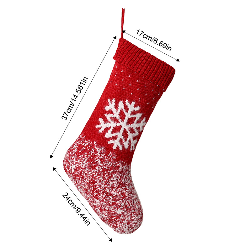 Red and white wool knitted Christmas stockings with snowflakes
