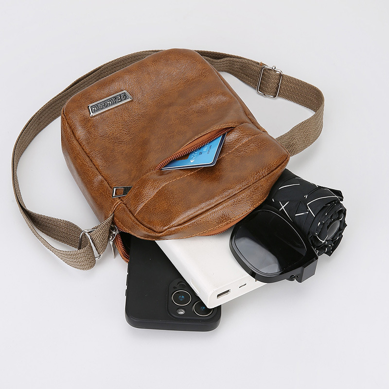 Comercio exterior simple retro bolso de hombro de viaje de negocios de cuero PU bolso portátil de ocio universal bolso de teléfono celular al por mayor