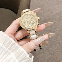 女士时尚多眼镶钻腕表闪耀钻圈环绕金白配色陶瓷表带米黄表盘精致