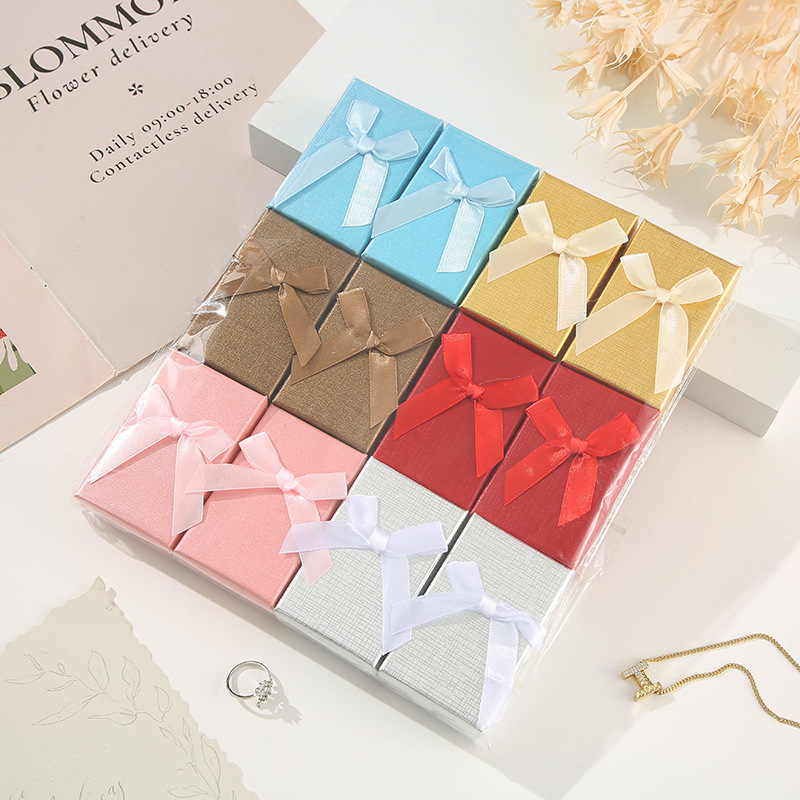 Moderno sistema minimalista de arco de color sólido caja pequeña caja de regalo de vacaciones caja de joyería hermosa caja de color mezcla al por mayor