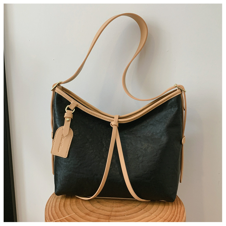 Bolso de brazo retro de gran capacidad para mujeres 2026 nuevo nicho de lujo ligero de hombro mochila de viaje ligero de lujo bolso de mano