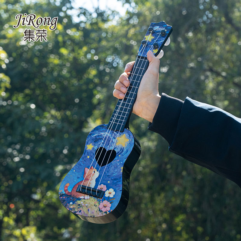 Comercio electrónico transfronterizo comercio exterior preferido ventas calientes 17 pulgadas dibujos animados para niños introducción pequeña cuatro cuerdas ukulele certificado completo