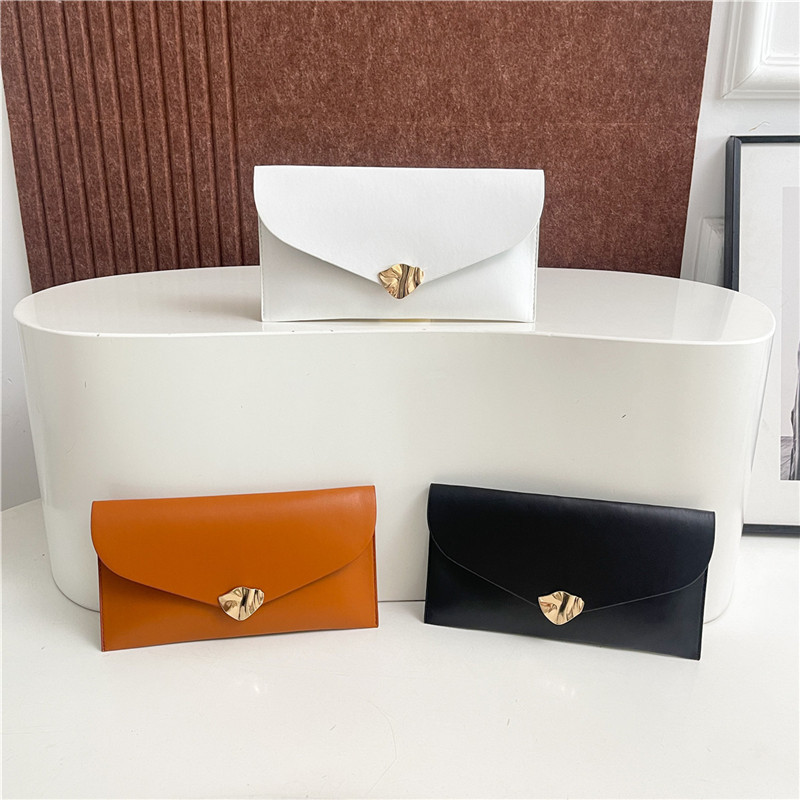 Commuting coreano ins alta sensación bolso de cena de moda casual nicho de diseño de color sólido bolso de mano universal