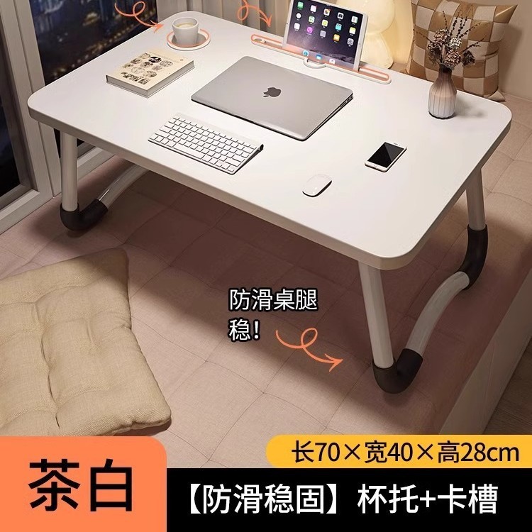 折り畳み可能なベッドの上の小さなテーブルは机のノートパソコンのテーブルを勉強します。|undefined