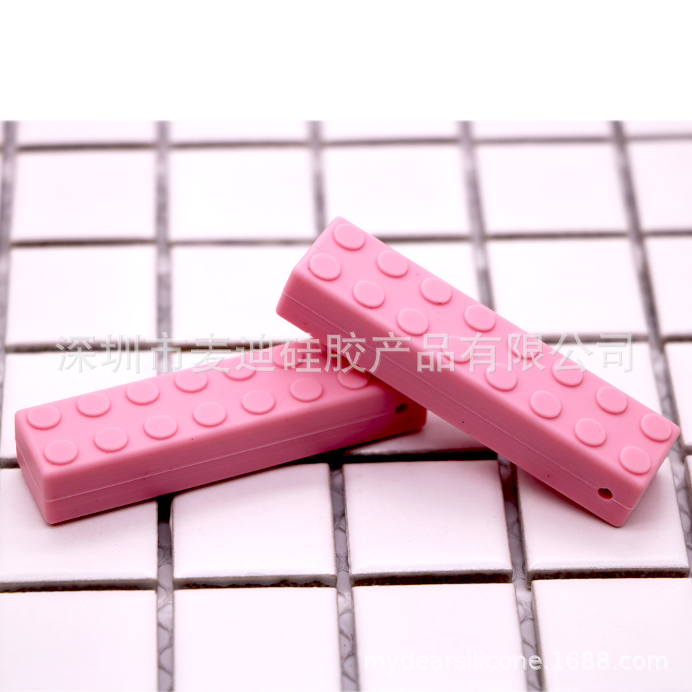 Bloques de construcción de silicona fabricantes de mordedor niños bloques de construcción de ladrillo de silicona teether sensorial masticar colgante bebé teether stick