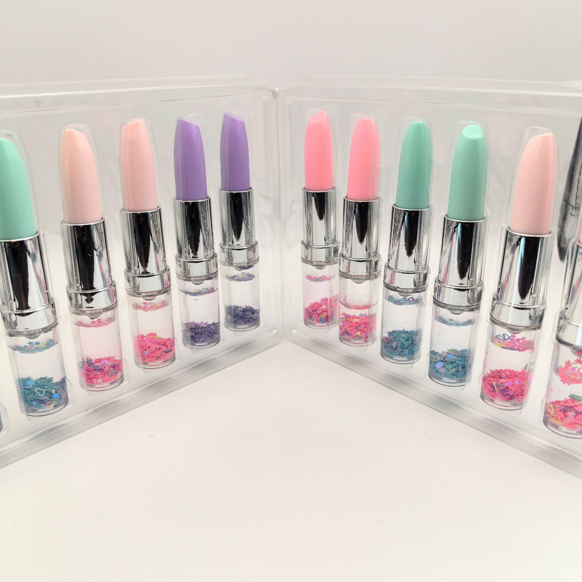 Fábrica de suministro directo de arena flotante sequinilla lápiz labial PVC lápiz labial estilo lápiz de bola japonés coreano lindo papelero conjunto lápiz