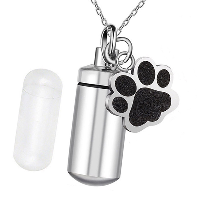 AliExpress venta caliente de acero de titanio memorial parientes mascota cinerario ataúd colgante puede abrir cilíndrica sello de pata botella de perfume collar