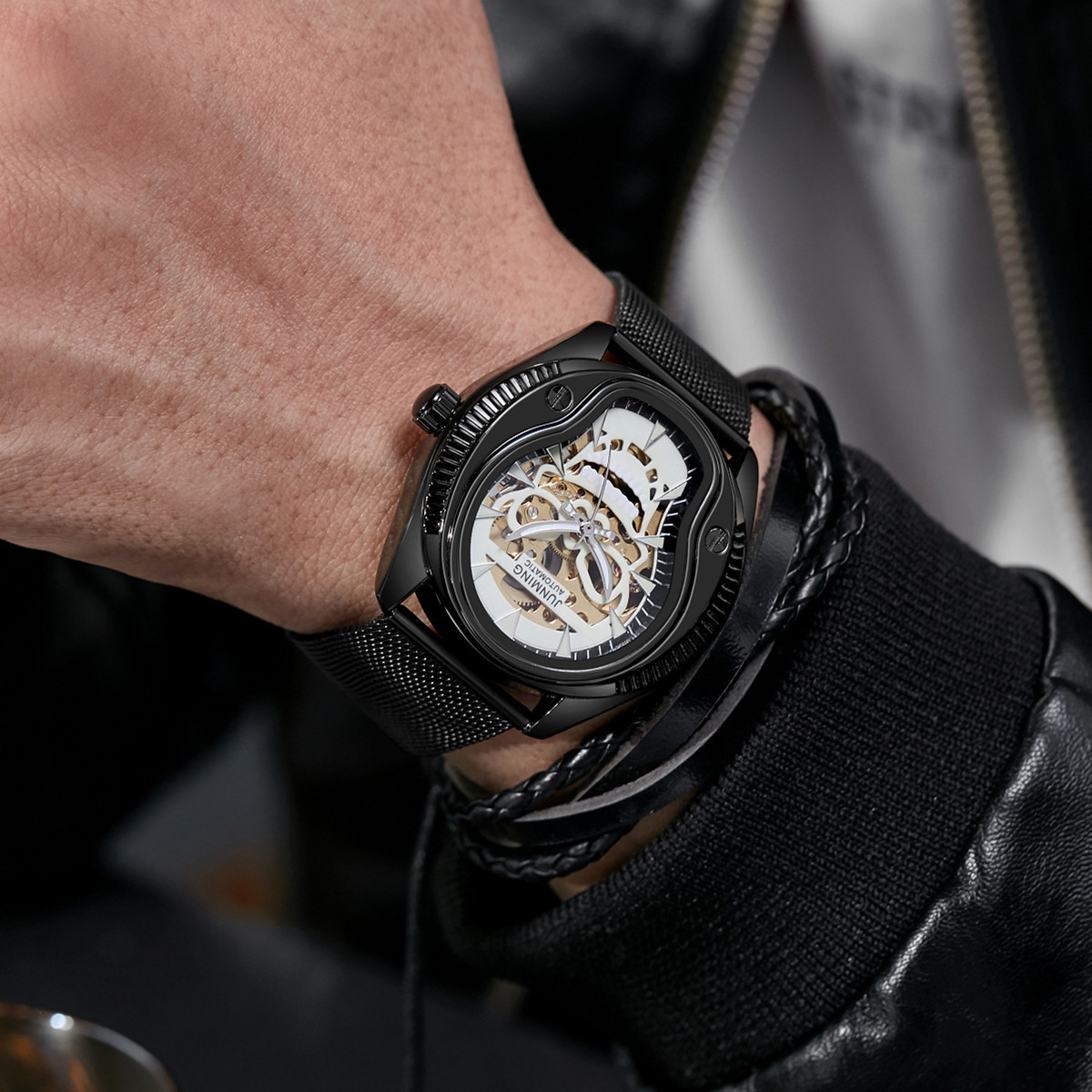 JUNMING Suiza productos genuinos moda impermeable reloj de los hombres correa de acero luminoso reloj mecánico automático cráneo hueco