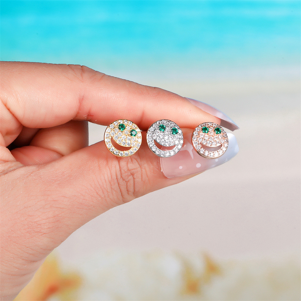 Classic Retro Smiley Ear Bone Studs Hollow Green Zircon Eye Earrings Wholesale display picture 3