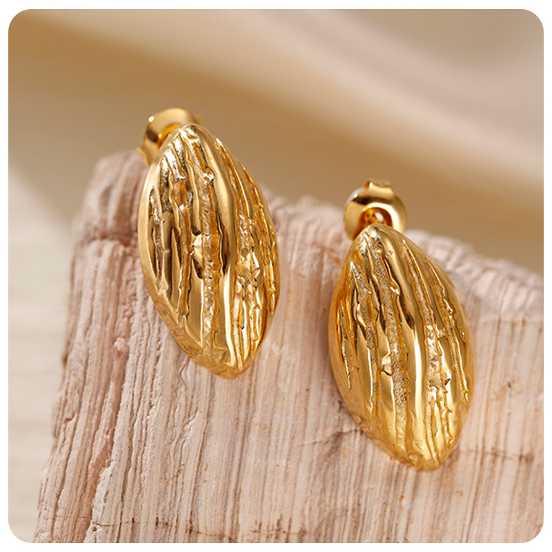 TENA transfronterizo de alta calidad texturas plegadas pendientes de acero inoxidable mujeres estilo de diseño de nicho simple pendientes de acero de titanio