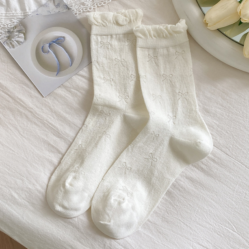 诸暨袜子女中筒袜秋冬纯色棉袜女士蝴蝶结芭蕾风无骨堆堆女袜批发