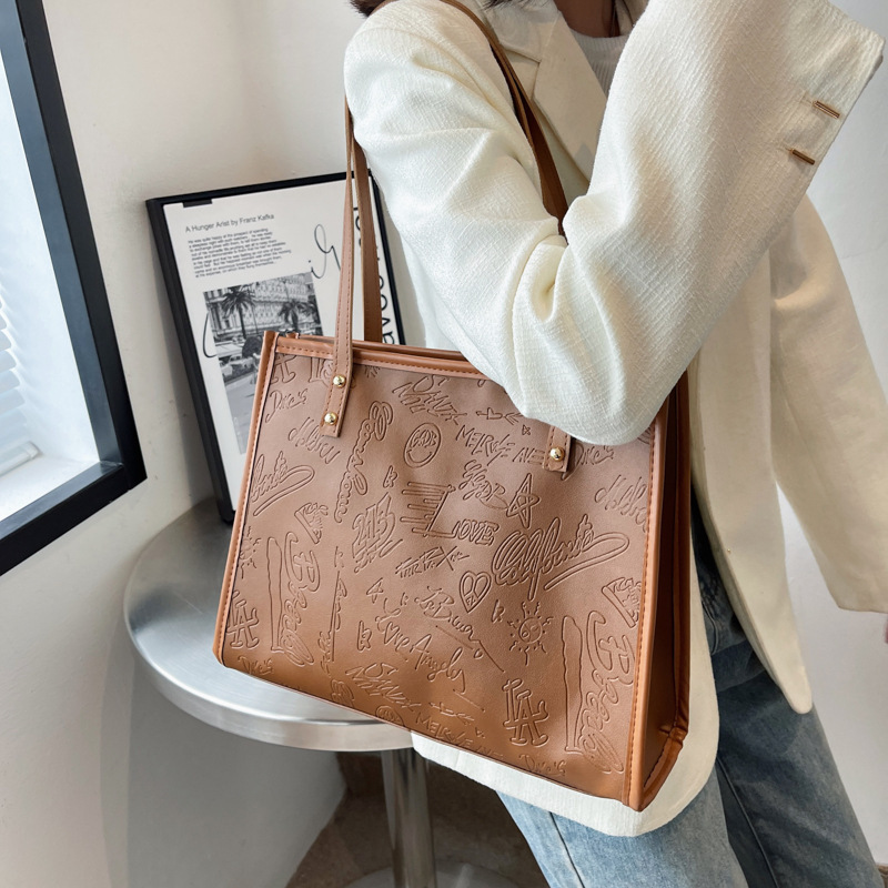 Bolso de mujer 2024 primavera nuevo nicho lienzo de cuatro hojas de gran capacidad bolso de hombro simple bolso de todo tipo