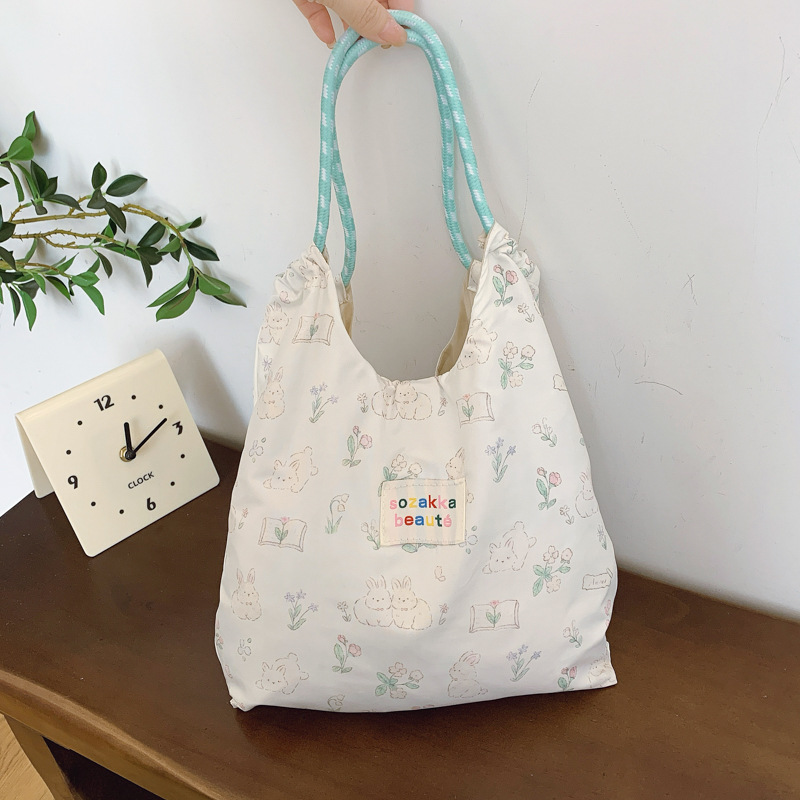 Japonés lindo y suave estudiante de gran capacidad bolso de hombro de mujer versión coreana pequeña fresca impresión de chicas bolsas de compras portátiles