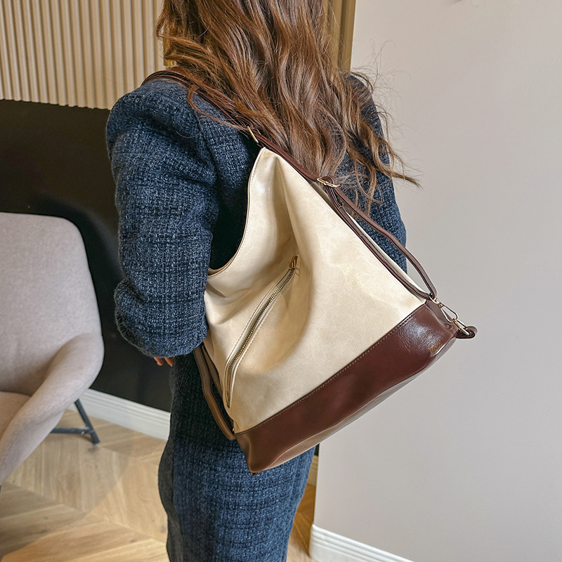 Cuero suave estilo coreano bolsa de hombro de gran capacidad para las mujeres 2024 principios de primavera nuevo versátil ins hombro axila bolsa