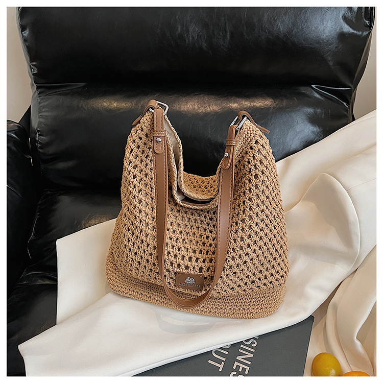 Summer hollowed-out knitted underarm bag for women, 2025 new style, laid-back and relaxed, seaside vacation style single-shoulder crossbody bag undefined