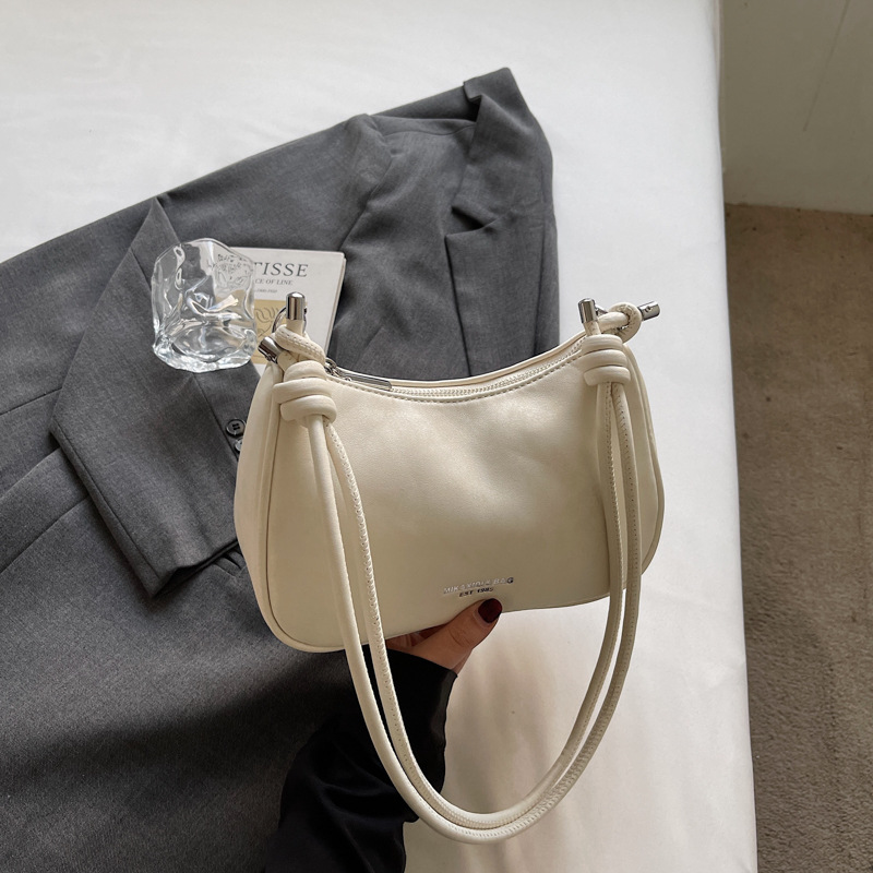 Bolsa de brazo de moda retro para mujeres 2026 primavera nueva simple diaria bolsa de bolsas de bolsillo de alto valor coreano hombro único