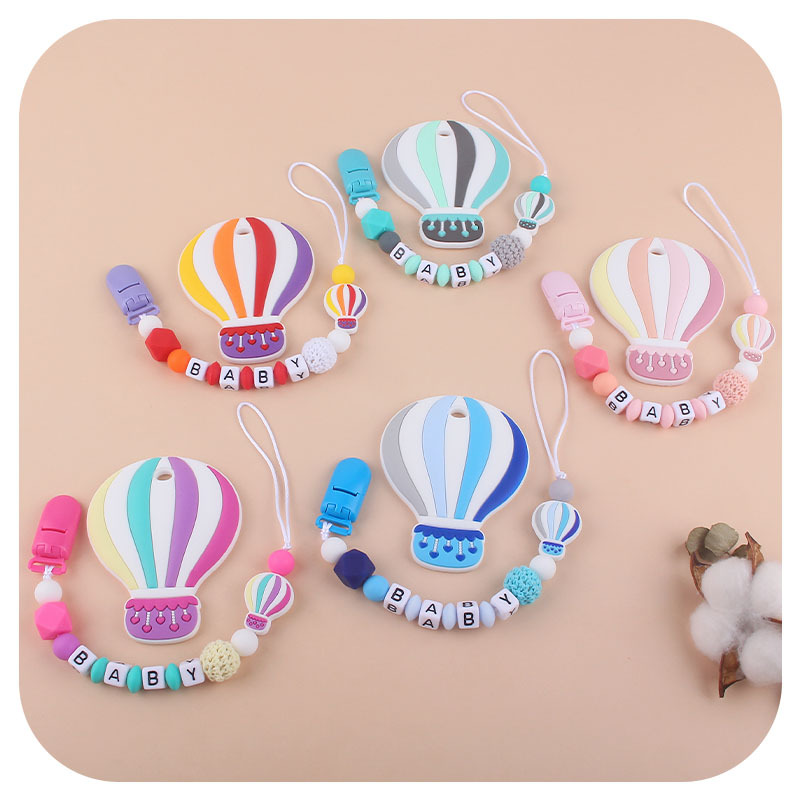 Bebé de dibujos animados de color globo de aire caliente de silicona teether personalizable nombre del bebé pezón anti-caída cadena teether traje