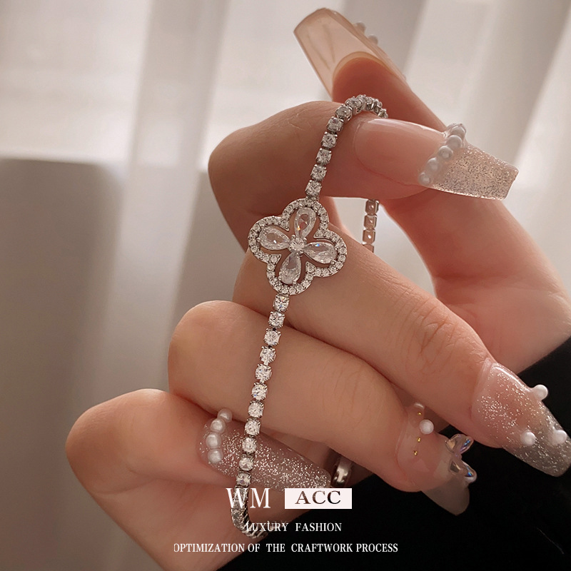 Oro real electrochapado ZIRCON flor hebilla pulsera moda todo-fósforo pulsera luz lujo alto sentido pulsera para las mujeres al por mayor