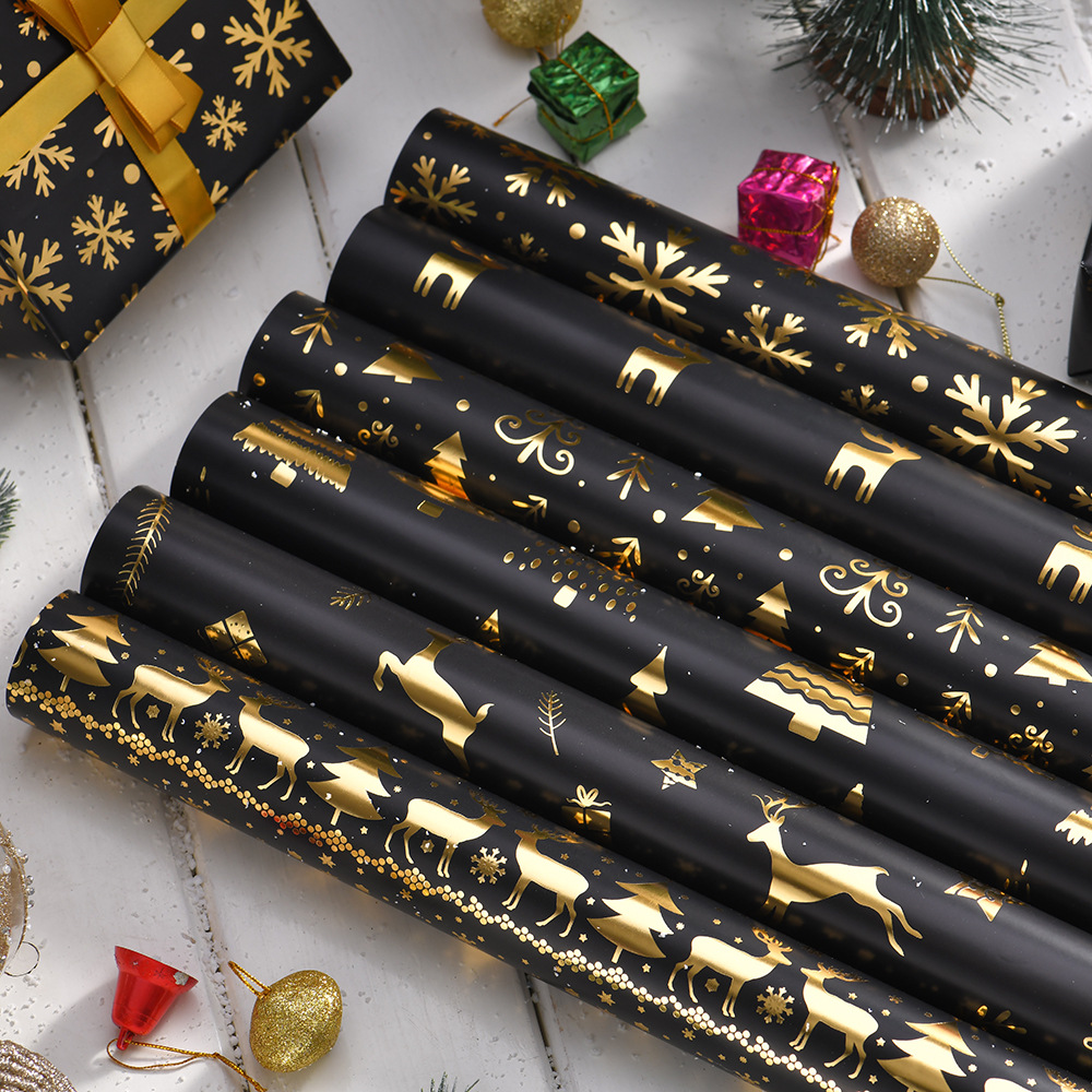 Nuevo papel de embalaje de Navidad estampado retro oro negro alce copo de nieve regalos de árbol de Navidad papel de regalo al por mayor