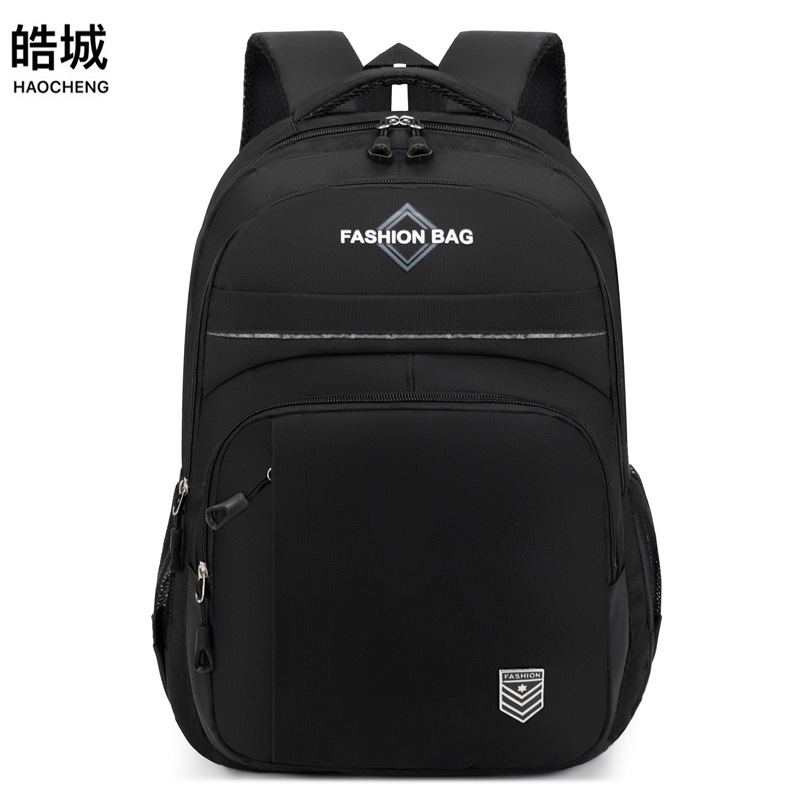 Mochila casual de color sólido para hombres de nuevo estilo, bolso de computadora de viaje de negocios de gran capacidad, mochila de estudiante de secundaria de moda