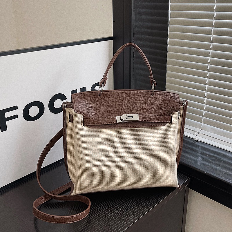 Bolsa de mano transfronteriza para mujeres 2026 nueva tela de lino empalmada color de textura de viaje mochila de hombro